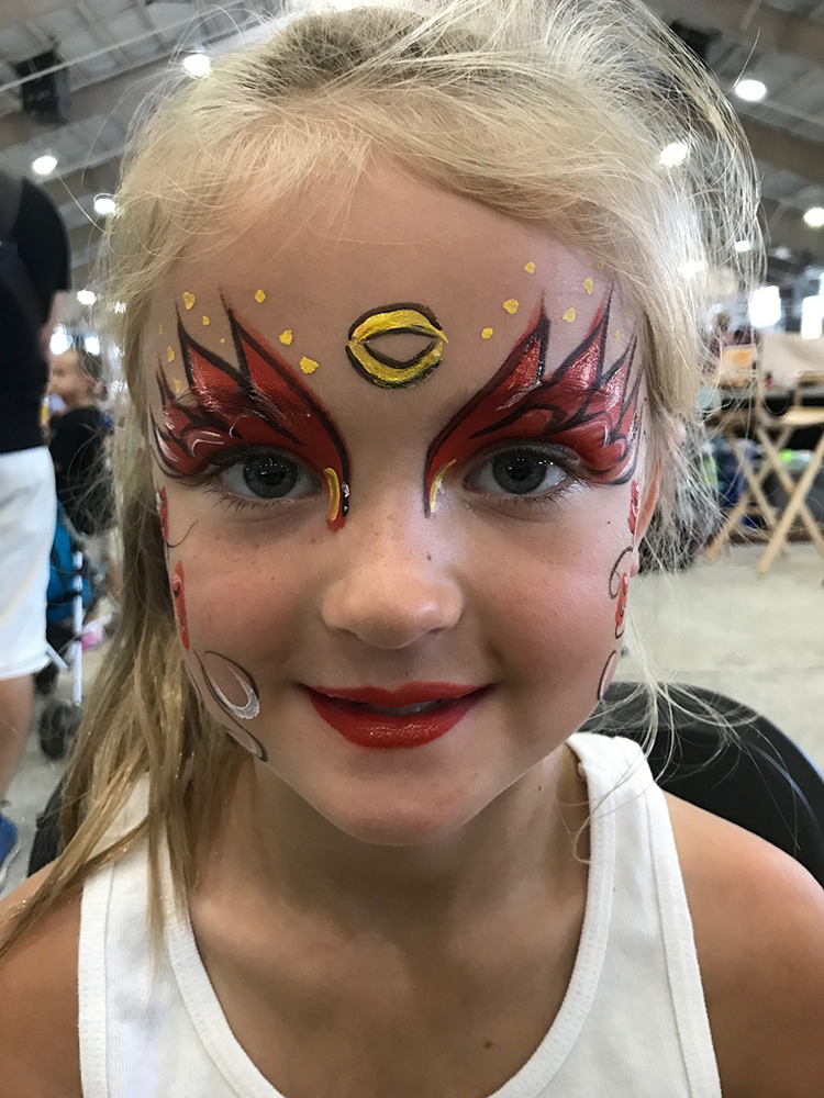 Girl with her face painted as a princess
